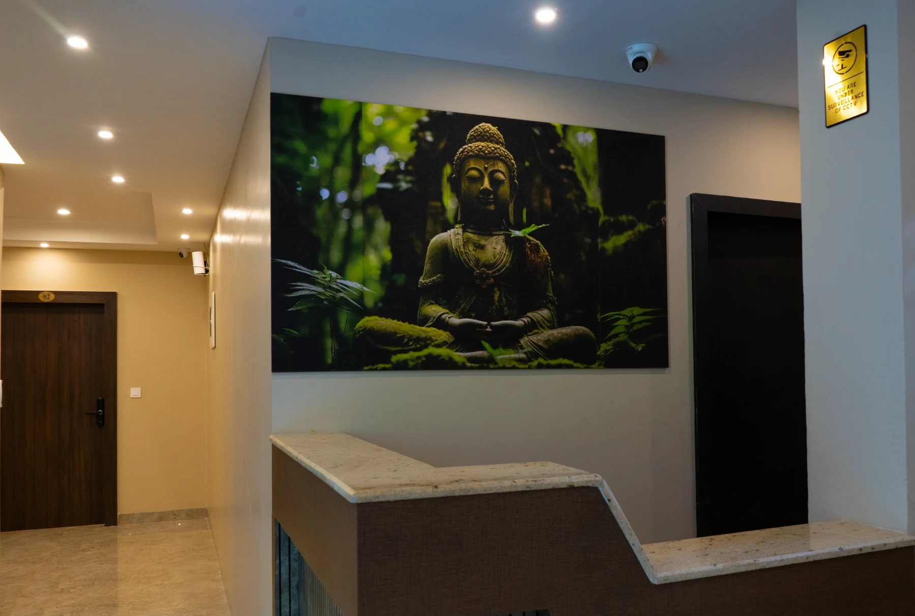 Reception corner with Buddha artwork
